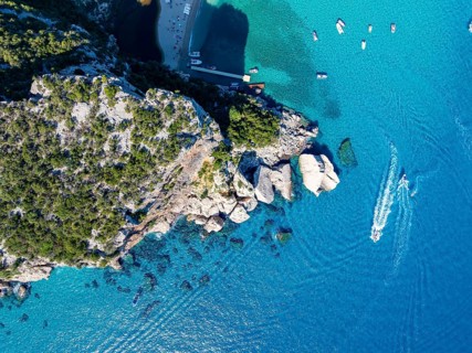 Picturesque rocky coast, cliffs and Cala Luna beach, aerial view, top-down, Golfo di Orosei,