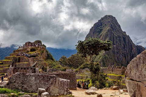 Dramatic sky over ancient ruins in front of a big mountain, The ruins of the Inca city of Machu