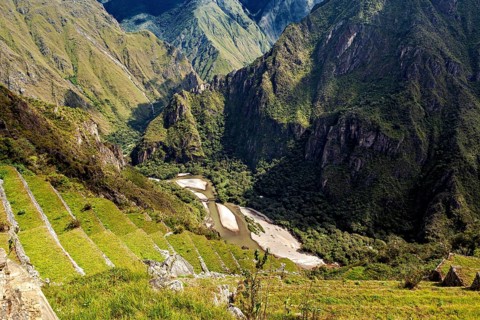 Green mountain terraces lead down into the valley, The Urubamba Valley near Machu Picchu in Peru