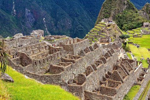 Stone ruins and agricultural terraces in an ancient urban landscape, The ruins of the Inca city of