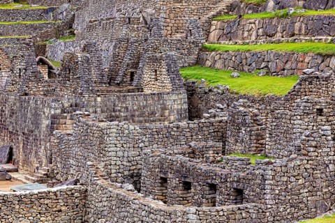 Detailed Inca stone structures and green terraces near Machu Picchu, The ruins of the Inca city of