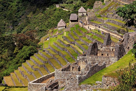 Historic Inca ruins with well-preserved terraces and huts, The ruins of the Inca city of Machu