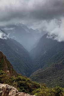 Mystical mountain landscape covered by clouds, The Urubamba Valley near Machu Picchu in Peru