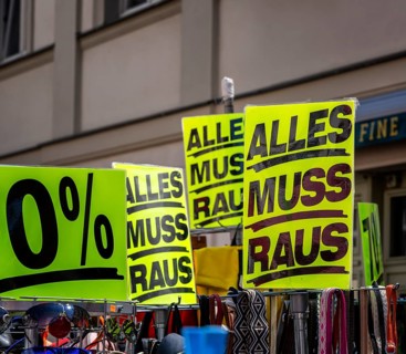 Retail trade with signs for price reductions and discounts, Potsdam, Brandenburg, Germany
