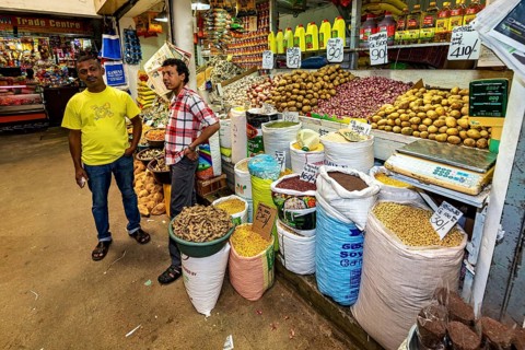 Retailers offer a variety of spices and foodstuffs, retailers in the market halls of Kandy Sri