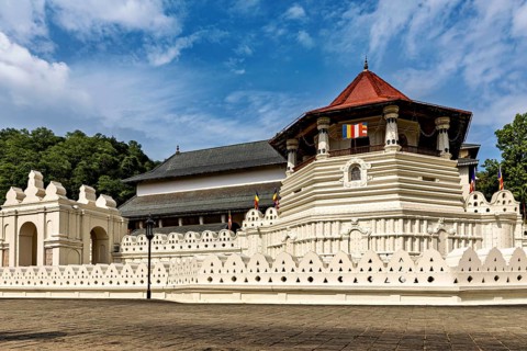 -View of a majestic historic building under a blue sky, The Temple of the Tooth in Kandy Sri Lanka