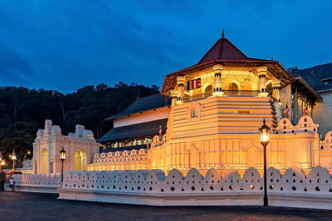 Historic building illuminated at night with atmospheric lighting, The Temple of the Tooth in Kandy