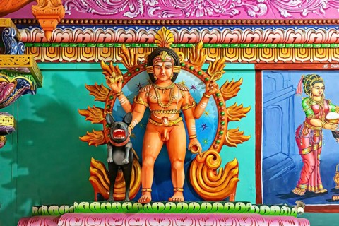 Temple sculpture with mythological scenes in bright colors and detailed depiction, The Sri