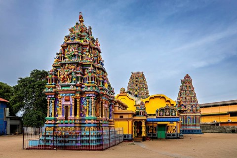 Magnificent exterior view of a Hindu temple with intricate carvings, The Sri Pathrakali Amman