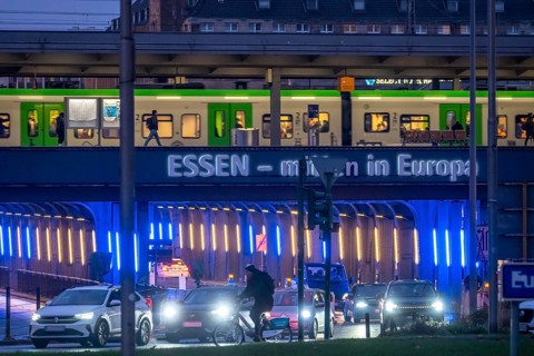 The main train station in Essen, blue-lit underpass, bus station, am Europaplatz, public transport