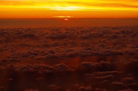 View from airplane window at sunrise