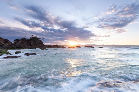 Sunset at Fisherman's Lookout. Dramatic waves and coastal scenery at The Pass, New South Wales,