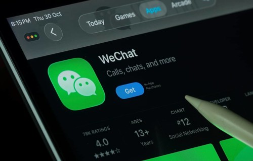 Dhaka, Bangladesh- 30 Oct 2025: WeChat app displayed on a iPad screen in dark mode with a digital
