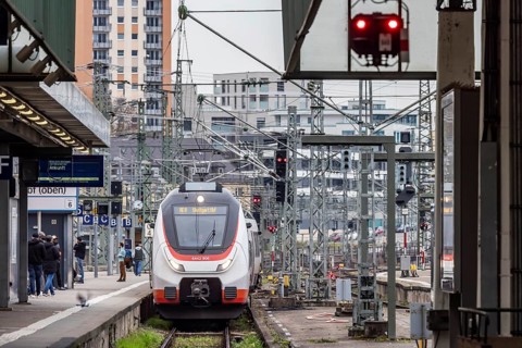 Platform in Stuttgart main station with regional train, overhead lines and track apron. Stuttgart,