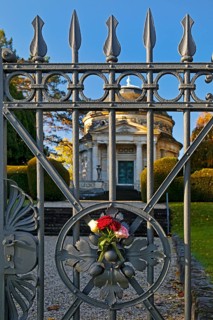 Roses at the fence door of the Carstanjen mausoleum in the Plittersdorf district, Bonn, North