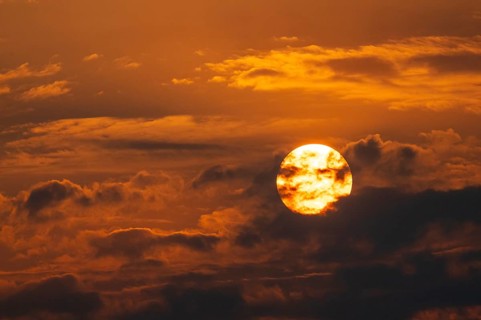 Dramatic sunset with clouds and sun, Etosha National Park, Namibia