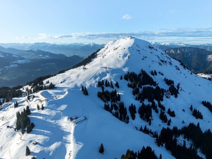 Wonderful winter landscape with Hohe Salve, blue sky and snow, mountains and mountain valley,