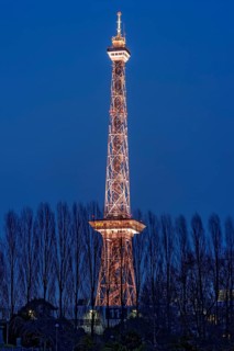 Red illuminated Berlin radio tower, half-timbered steel building by architect Heinrich Straumer,