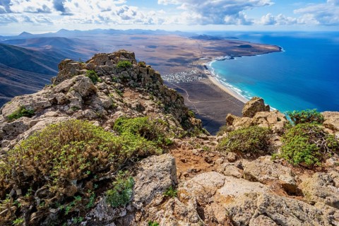 Castillejo viewpoint, view from the Risco de Famara cliffs to the coast and the sea with the Famara