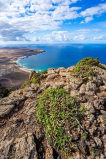 Castillejo viewpoint, view from the Risco de Famara cliffs to the coast and the sea with the Famara