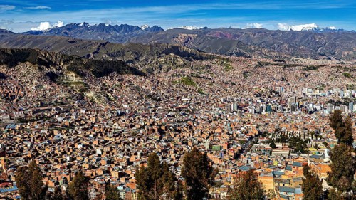 Panoramic view of a sprawling city with mountains on the horizon, the city of La Paz in Bolivia