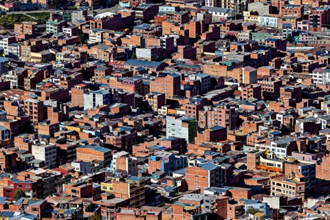Narrowly built, dense city view with predominant brick buildings, the city of La Paz in Bolivia