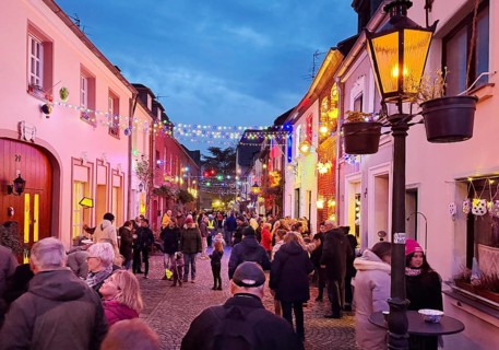 People in the Tiefstraße decorated for the Martin train in the evening, historic old town, Kempen,