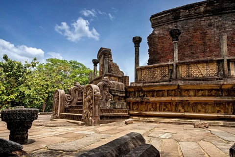 Ancient ruins with richly designed stone sculptures and open-air columns, The temples of