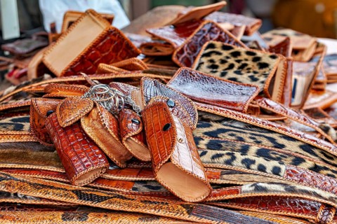 Market with brown leather accessories and eye-catching leopard patterns, leather products from