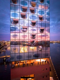 Aerial view of the Elbe Philharmonic Hall with reflections on the façade in the evening light above