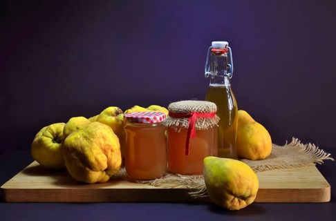 Still life with quinces, homemade quince jelly and quince liqueur, autumn, Germany