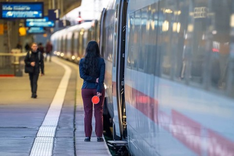 ICE train ready for departure, train staff waiting for the signal to continue, at Essen main