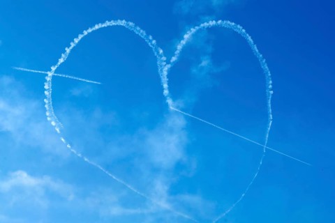 The Indian Air Force aerobatic team performs during an air show as part of the 93rd Air Force Day