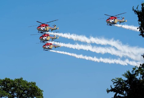 Indian Air Force (IAF) ALH Mk1 Sarang helicopters soar through the sky during an air show as part