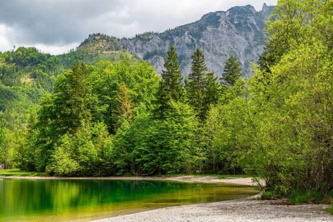 Landscape of Lake Offensee after rain when the sun comes through the clouds in spring,
