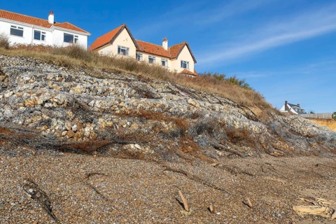 Clifftop houses at risk from coastal erosion, Thorpeness, Suffolk, North Sea coast, England, UK