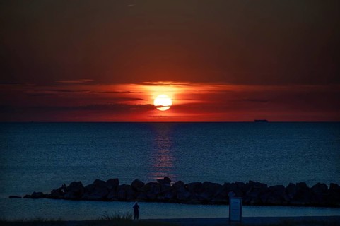 Sunset on the Baltic Sea with protective breakwaters, Darß, Ahrenshoop, Mecklenburg-Western