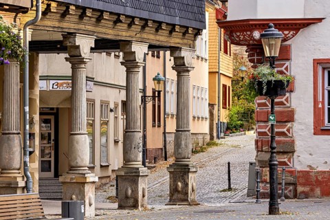 Half-timbered architecture along a quiet cobblestone street with lanterns, The old town of Arnstadt
