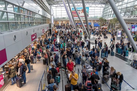 Full check-in hall, queues, Terminal B, many thousands of people take off on the first day of the