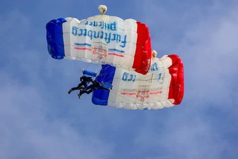 Two parachutists during an aerial acrobatic performance as part of an air show at the Rossfeld in