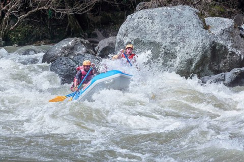 A group of people white water rafting, Costa Rica, Central America