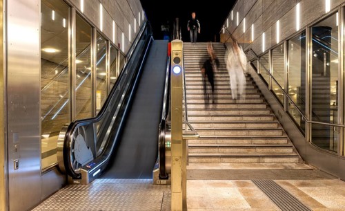 Night photo, long exposure with motion blur, modern underground entrance at Unter den Linden