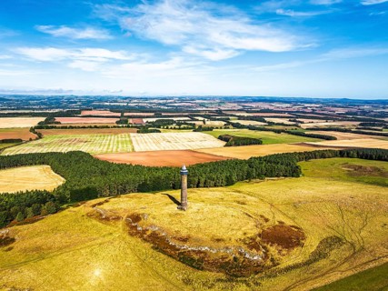 Waterloo Monument over Scottish fields and farms from a drone, Jedburgh, Scotland, UK