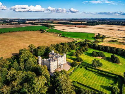 Wedderburn Castle and Barns over fields from a drone, Duns, Berwickshire, Scotland, UK