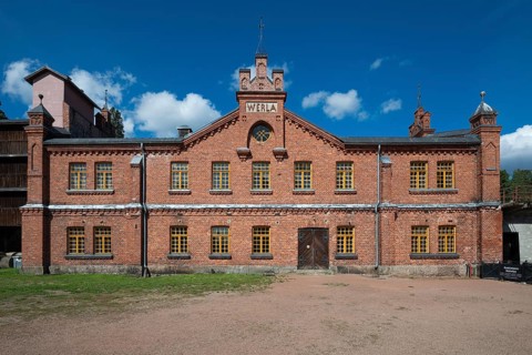 Brick façade with inscription Werla, former paper factory and mill for the production of groundwood