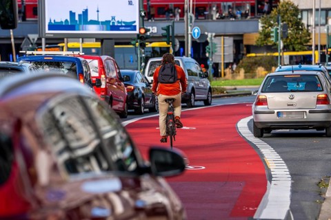 Cycle path, cycle lane, marked in red to draw the attention of motorists to the cycle path, between