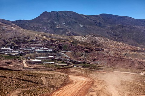 Village on the slope of a mountain in the middle of a dry hilly landscape, The landscape of the