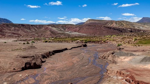 Erosion landscape with dry riverbed in a desert region, The landscape of the Altiplano in Bolivia