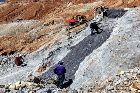 Workers moving stones on a construction site in a hilly environment, The silver mines of Potosi