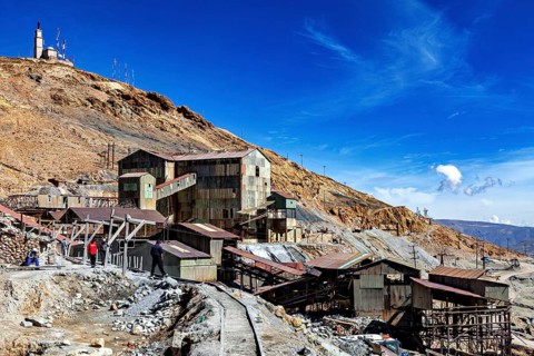 Old industrial plants in a rocky area under a clear blue sky, The silver mines of Potosi Bolivia